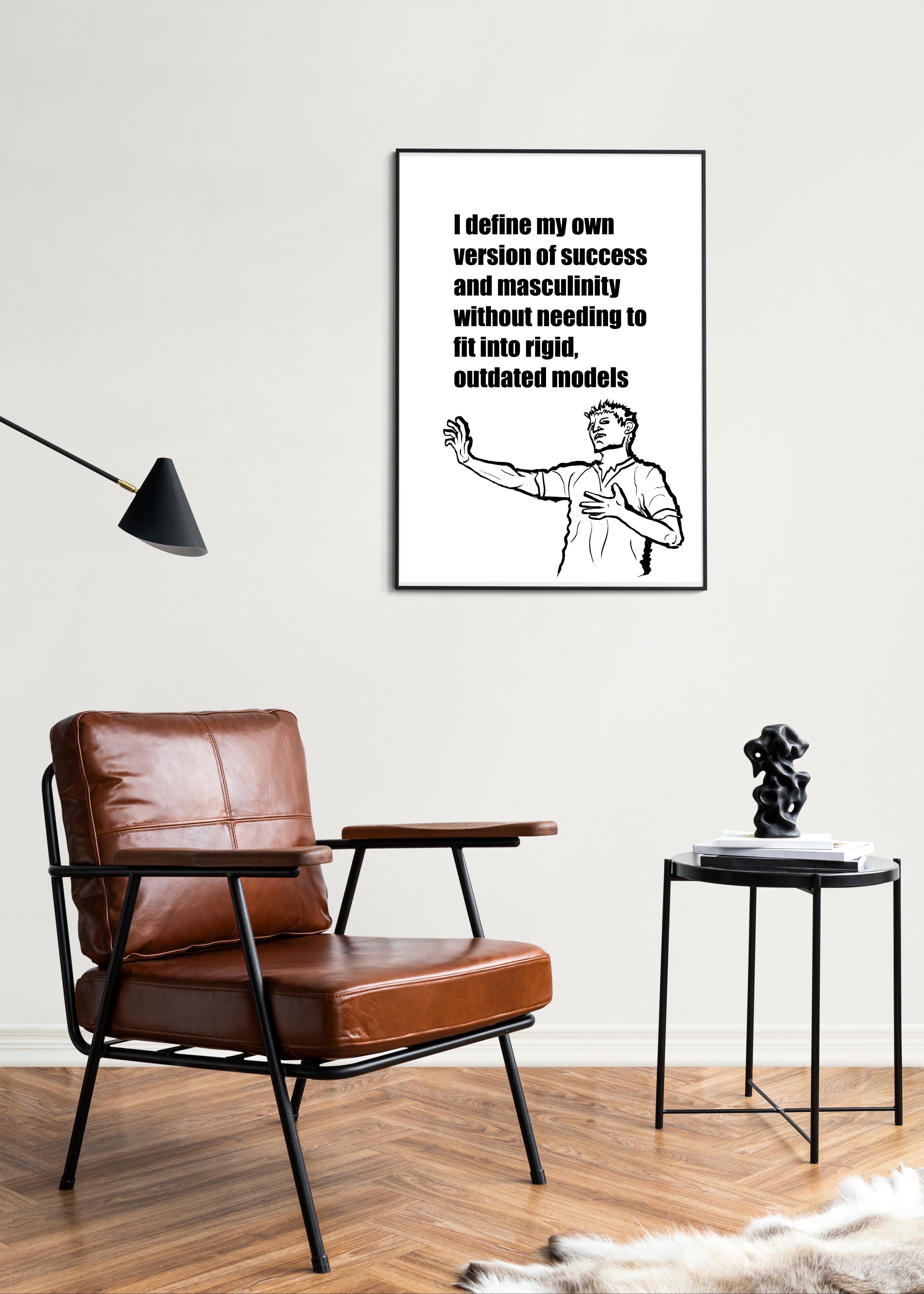 Living room with brown leather chair, side table, and framed motivational poster on the wall.
